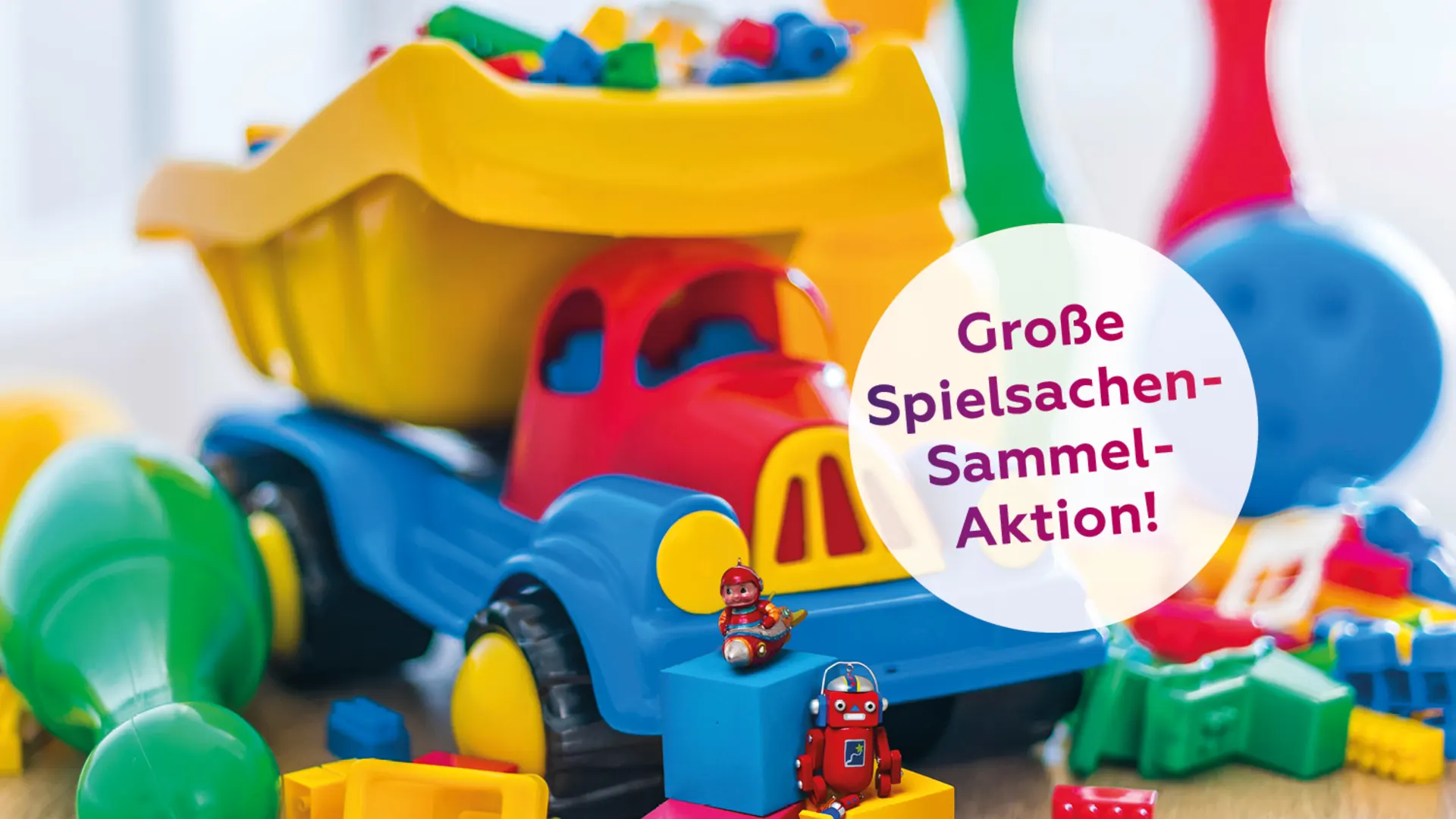 Coverbild Kinder f Ki WEB720x500 Ein bunter Spielzeug-LKW sowie einige bunte Bauklötze