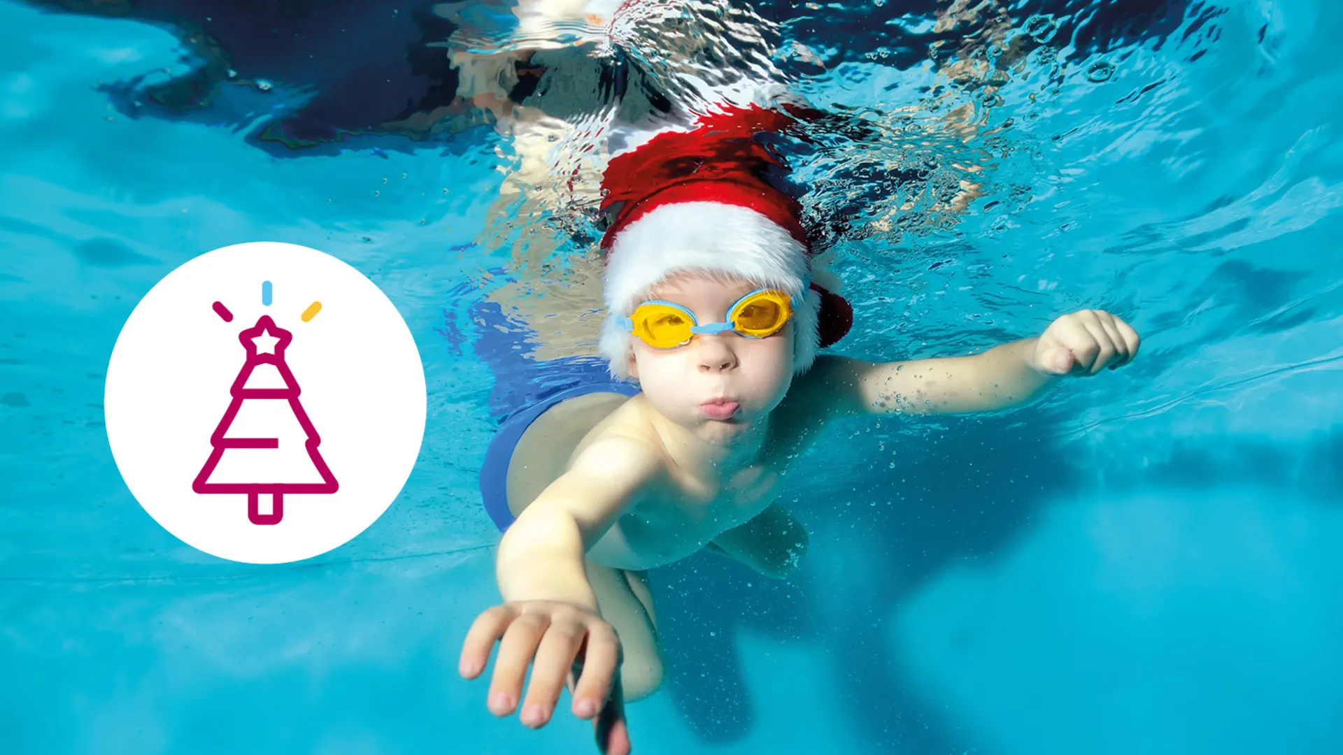Coverbild Weihnacht WEB720x500 Kind mit einer Nikolausmütze und einer Schwimmbrille unter Wasser